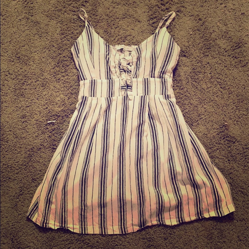 A black and navy dress with ties in the front